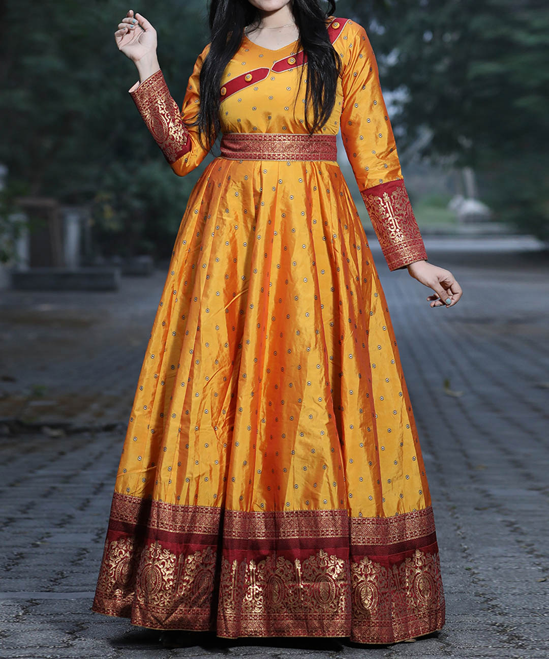 Unique mustard yellow colored festive wear gown crafted from woven Tapetta silk, ideal for special celebrations.