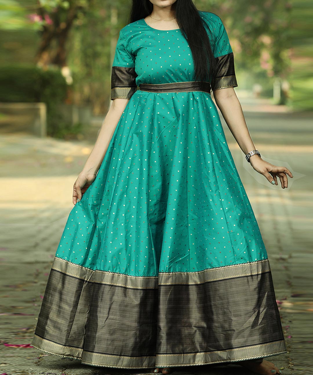 Graceful Rama Green Colored Festive Wear Woven Tapetta Silk Gown
