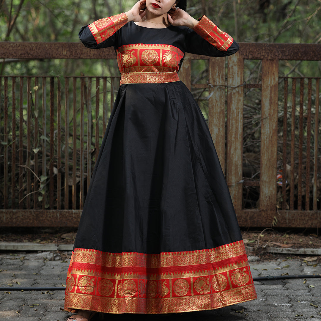 Flattering Black Colored Festive Wear Woven Tapetta Silk Gown