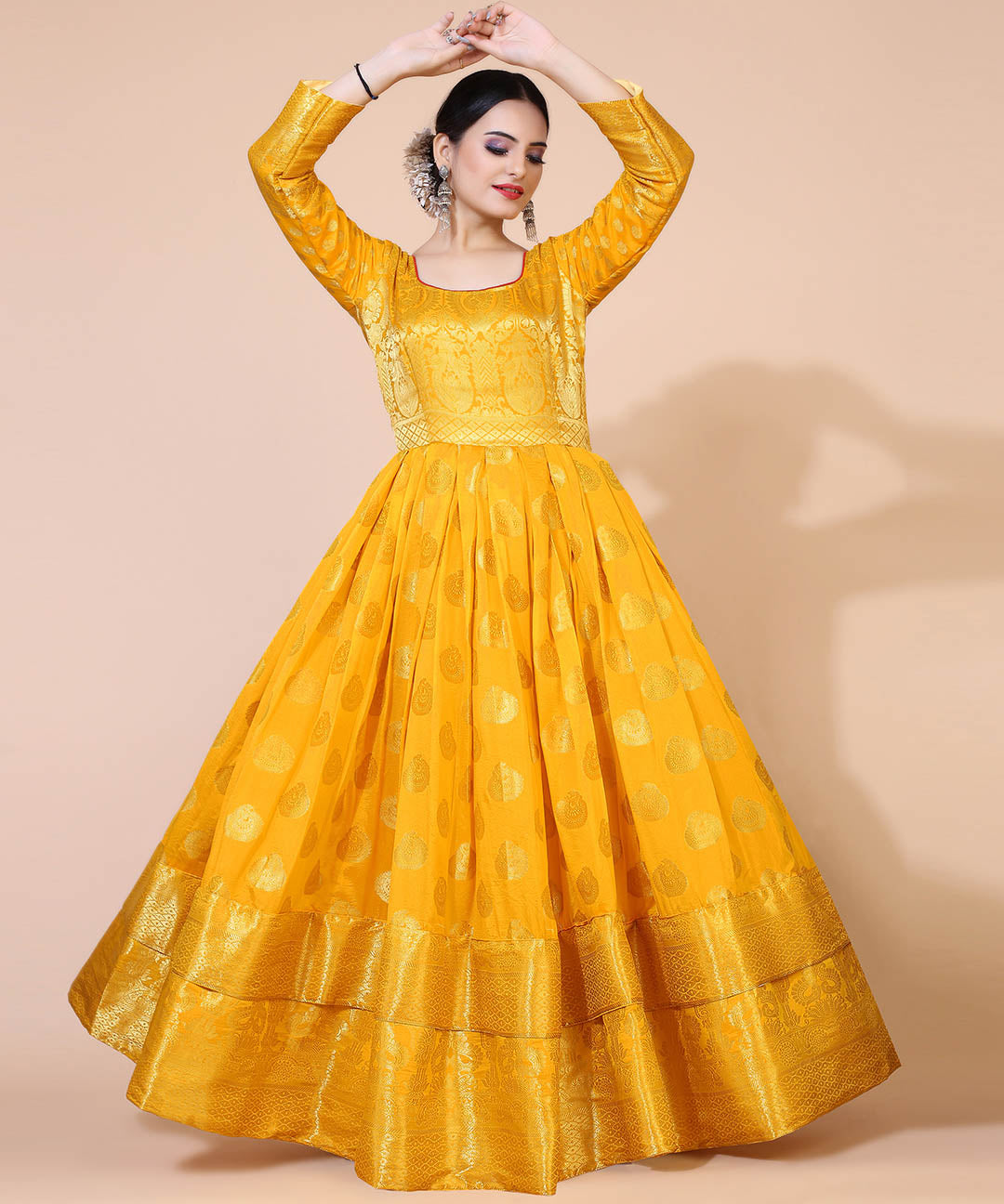Yellow jacquard maxi dress with ethnic motifs, ideal for cultural and festive occasions.