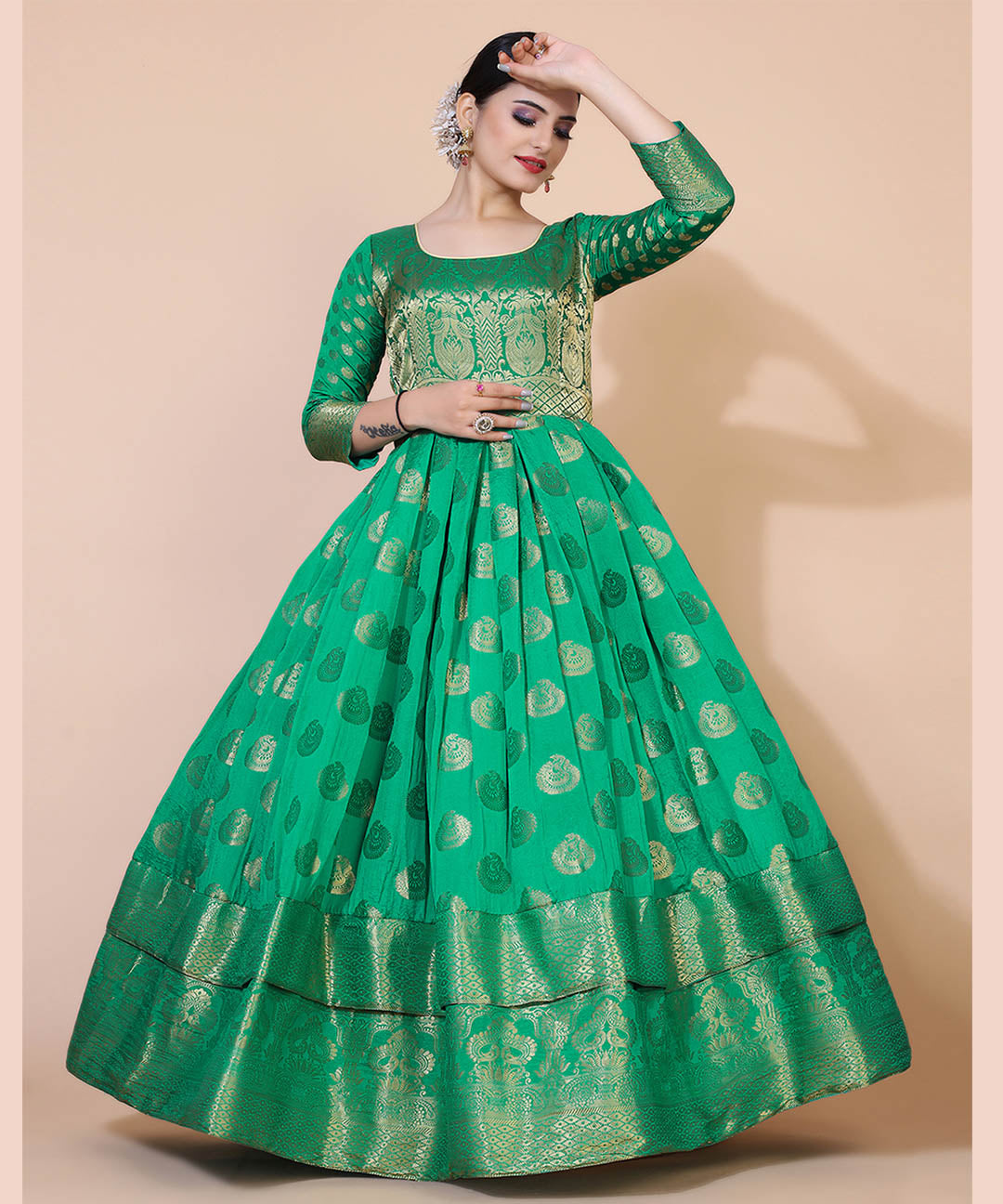 Women's green jacquard maxi dress adorned with ethnic motifs, ideal for cultural and festive occasions.