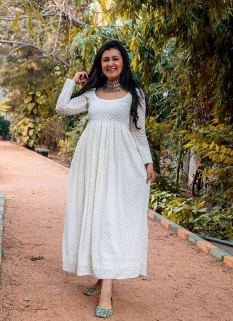 Elegant off-white georgette frock with flowing pleats and intricate Lucknowi chikankari embroidery.