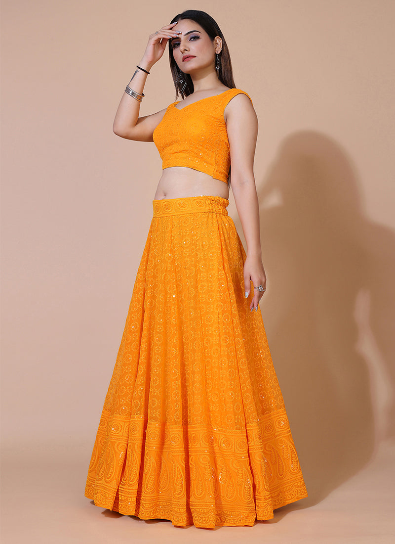 Dusty orange lehenga choli with traditional Lucknowi chikankari embroidery.     tune  share   more_vert