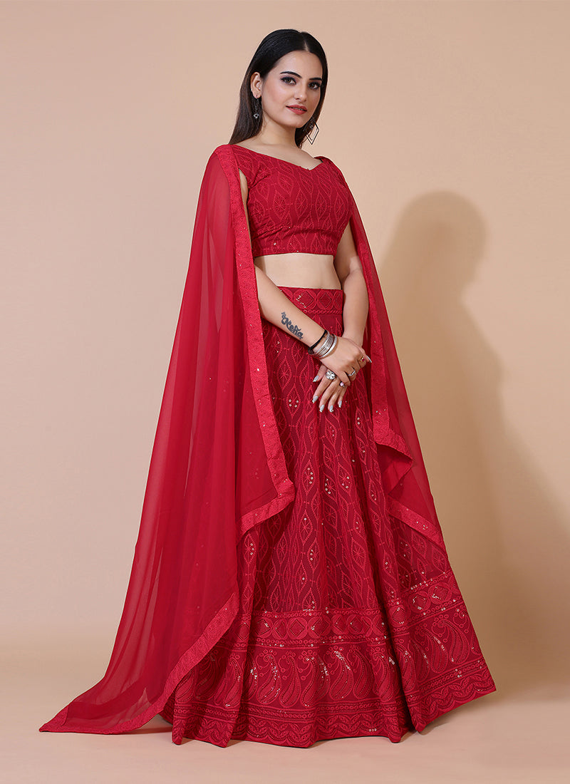 Red A-line Lucknowi Chikankari work stitched lehenga choli, ideal for traditional and festive celebrations with intricate embroidery.